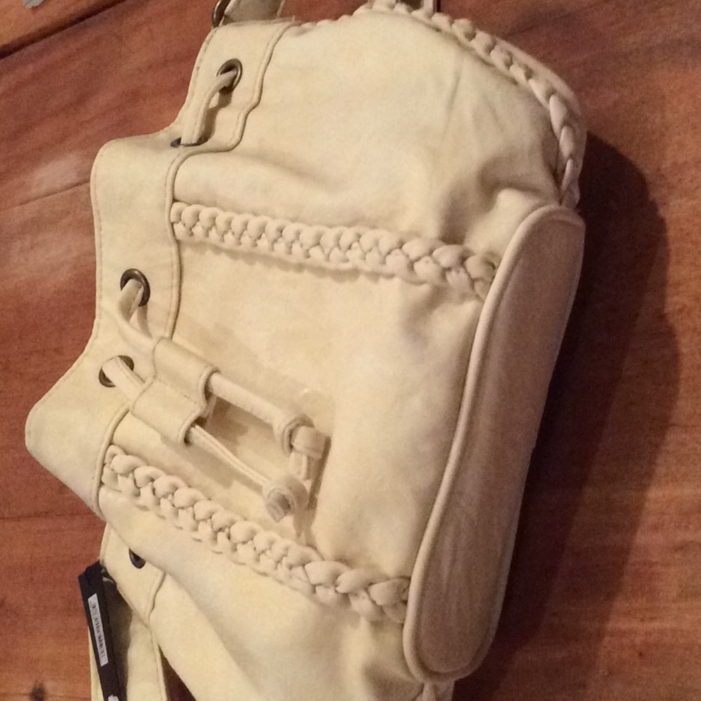 Macy’s bucket bag in soft cream leather